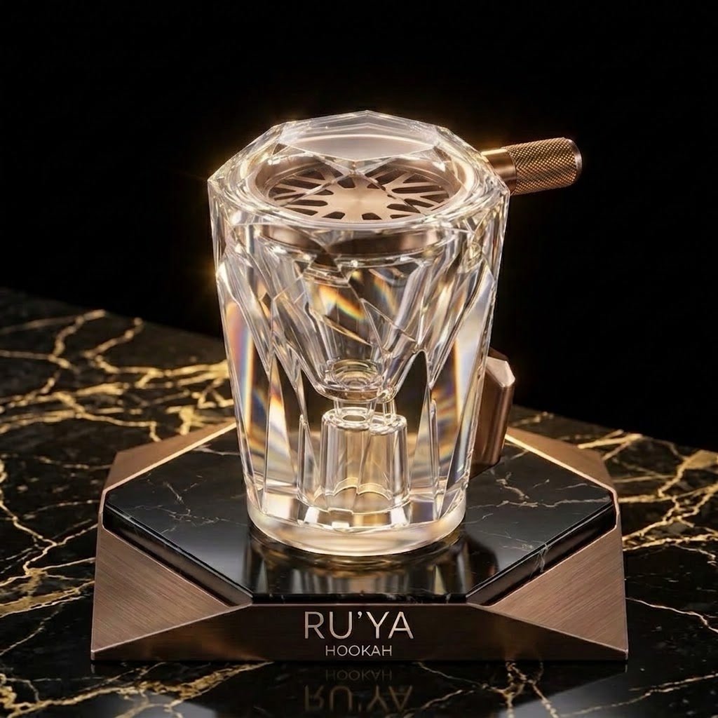 The RU'YA crystal bowl on its bronze base, faceted like a brilliant-cut gemstone
